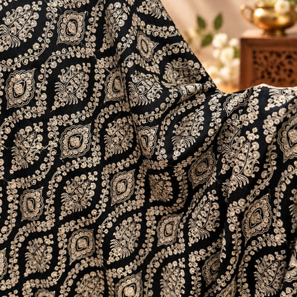 Close-up of white Jaal embroidery on black Kashmiri shawl