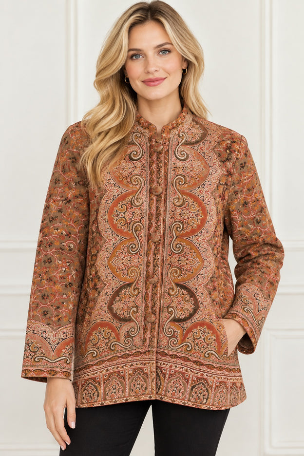 Kani Jamawar women's short winter jacket, rust paisley, front view on model, hand in side pocket